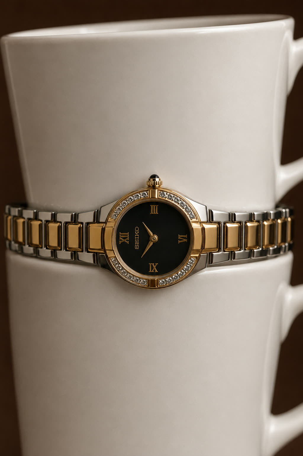 Detail of the same watch angled to show the bezel and the polished link bracelet